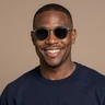 Marcus T., a blind man and BeyondLimits member from Chicago, smiling warmly in a portrait photo