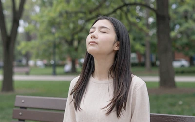 Person practicing calming techniques before a date, representing anxiety dating tips