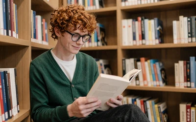 Autistic man relaxing in a library representing the autism dating site community